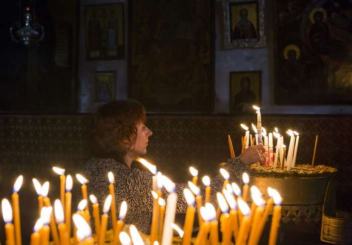 Worshipper-candle-Bethlehem-West-Bank-Advent.jpg