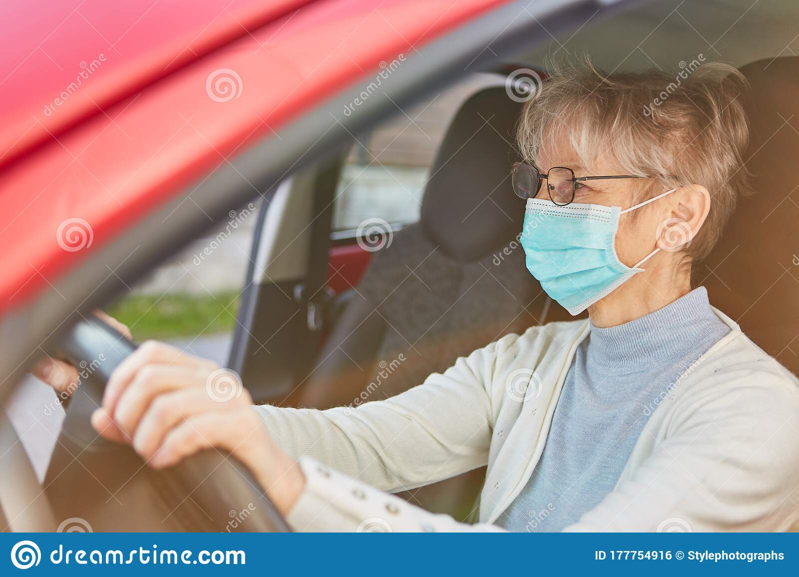elderly-woman-wearing-face-mask-driving-car-covid-coronavirus-pandemic-elderly-woman-wearing-face-mask-177754916