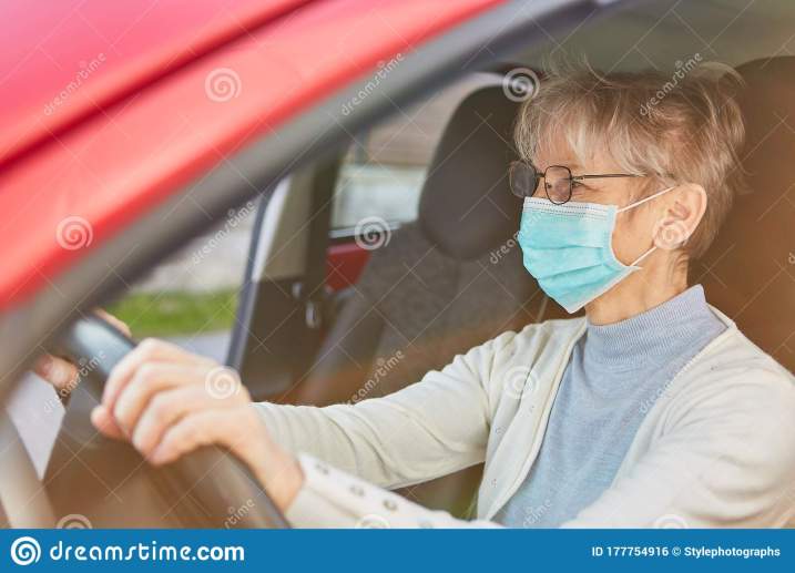 elderly-woman-wearing-face-mask-driving-car-covid-coronavirus-pandemic-elderly-woman-wearing-face-mask-177754916